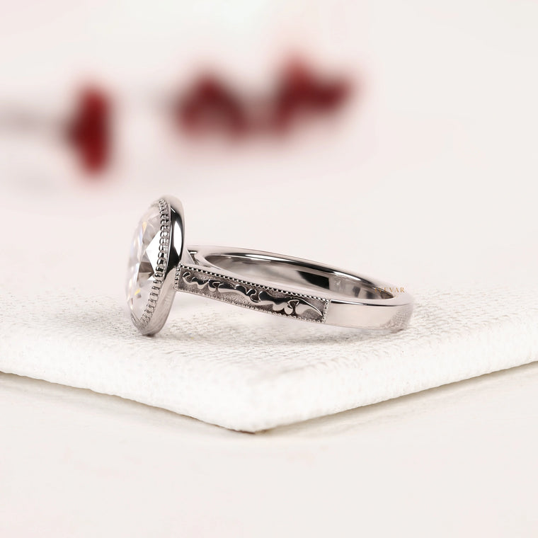Oval Cut Bezel Moissanite Engagement Ring with Vintage Engraved Band - view 2