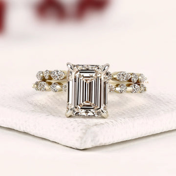 Hidden halo emerald cut lab grown diamond bridal set with pave band