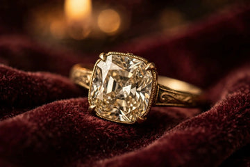 Antique old mine cushion cut diamond ring on vintage velvet fabric