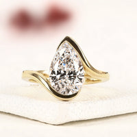 3.00 Pear Cut Lab Grown Diamond Solitaire Ring in Flowing Gold Setting Timeless Elegance By Ivevar