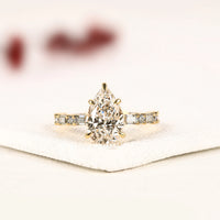 Pear Cut Lab Grown Diamond Engagement Ring with Baguette Accent Band