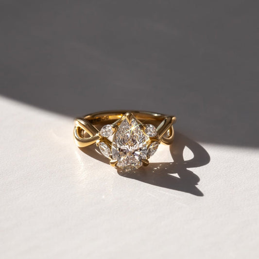 2.50 CT Contemporary Statement Pear Solitaire Lab Grown Ring with Sculpted Gold Band and Side Accent Stones
