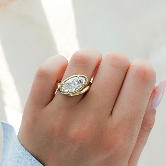 3.00 TCW Bezel Style Marquise Lab Grown Diamond Solitaire Ring with Flowing Gold Wrap Band For Party