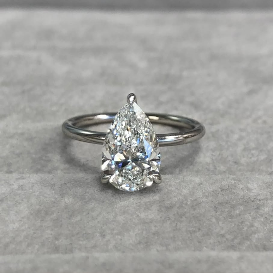 3.51 TCW Graceful Pear Cut Moissanite Solitaire Ring with Classic Three Prong Setting and Slim High Polish Gold Band