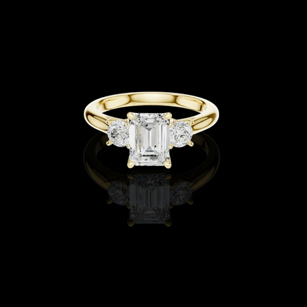 Classic Emerald With Round Side Moissanite Ring