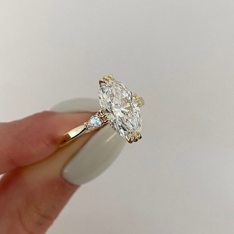 Oval Cut Claw Prong Solitaire Ring with Side Accents - view 2