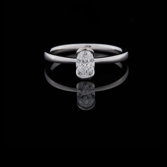 1.00 TCW Modern Oval Cut Moissanite Diamond Solitaire Ring with Sleek Half Bezel Setting in Polished White Gold