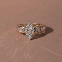 3.00 CT Starlane Marquise Lab Grown Diamond Ring with Channel Set Baguette Accents in Refined Gold