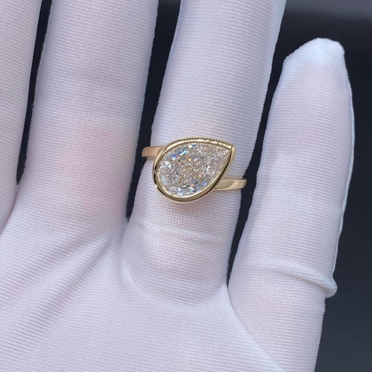 Pear Cut Moissanite Bezel Set Engagement Ring - view 4