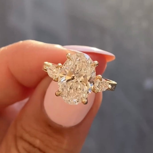 3.00 CT Regal Aura Oval Cut Moissanite Diamond Ring with Twin Pear Accents in Classic Prong Setting