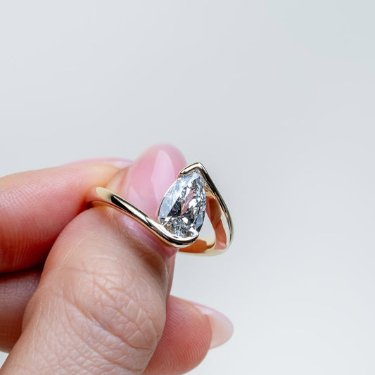 1.00 CT Aurora Flow Pear Cut Moissanite Diamond Ring with Sculptural Bypass Embrace For Your Girl