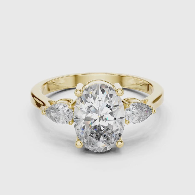 Oval Three Stone Moissanite Ring with Pear Side Stones video