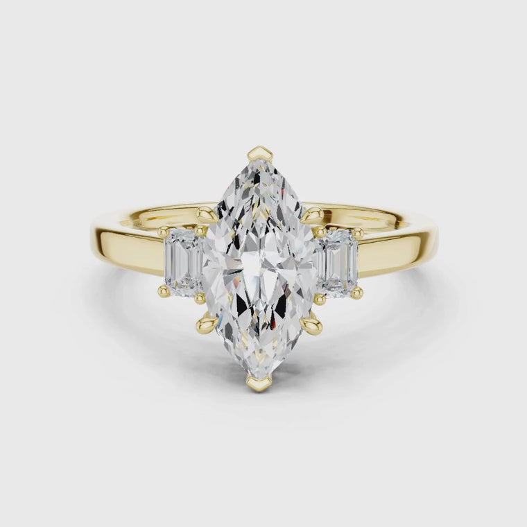Marquise Engagement Three Stone Ring with Emerald Side Stone video