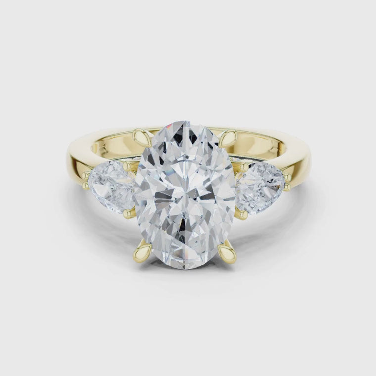 Oval Cut Three Stone Ring With Pear Side Stones video
