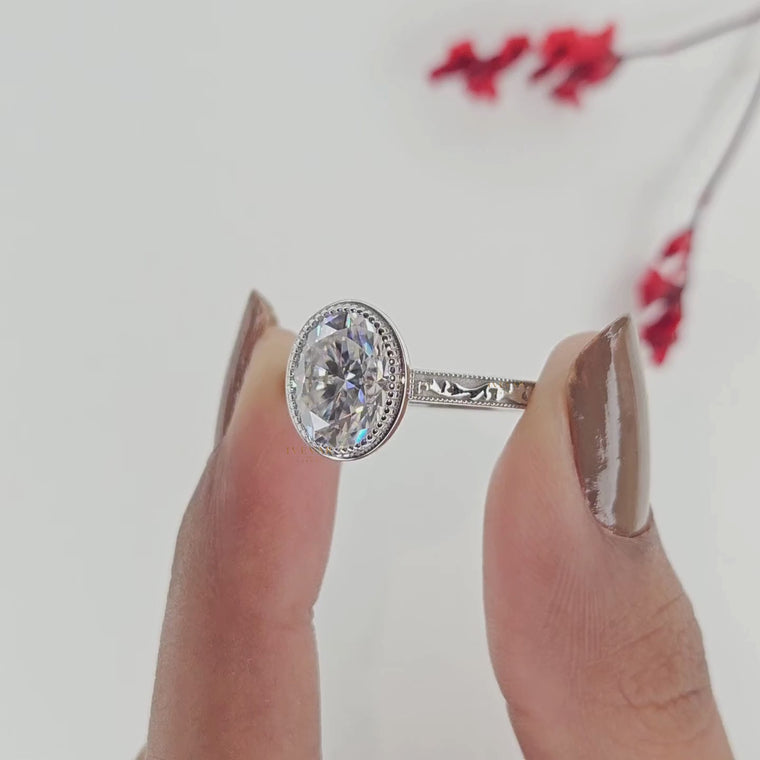 Oval Cut Bezel Engagement Ring with Vintage Engraved Band video