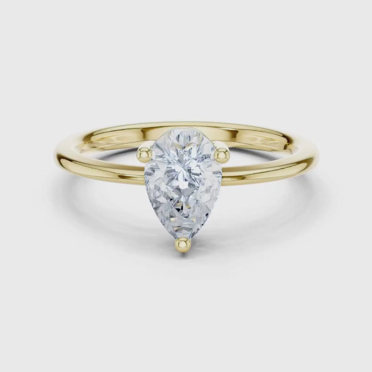 Pear Cut Moissanite Three Prong Solitaire Ring video