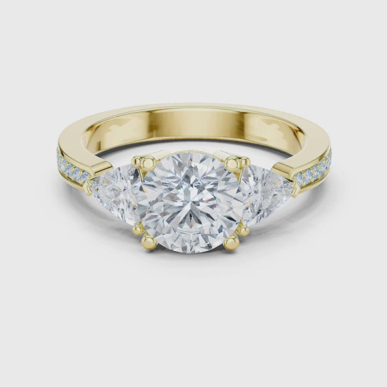 Round Engagement Ring With Trillion Side Stone video