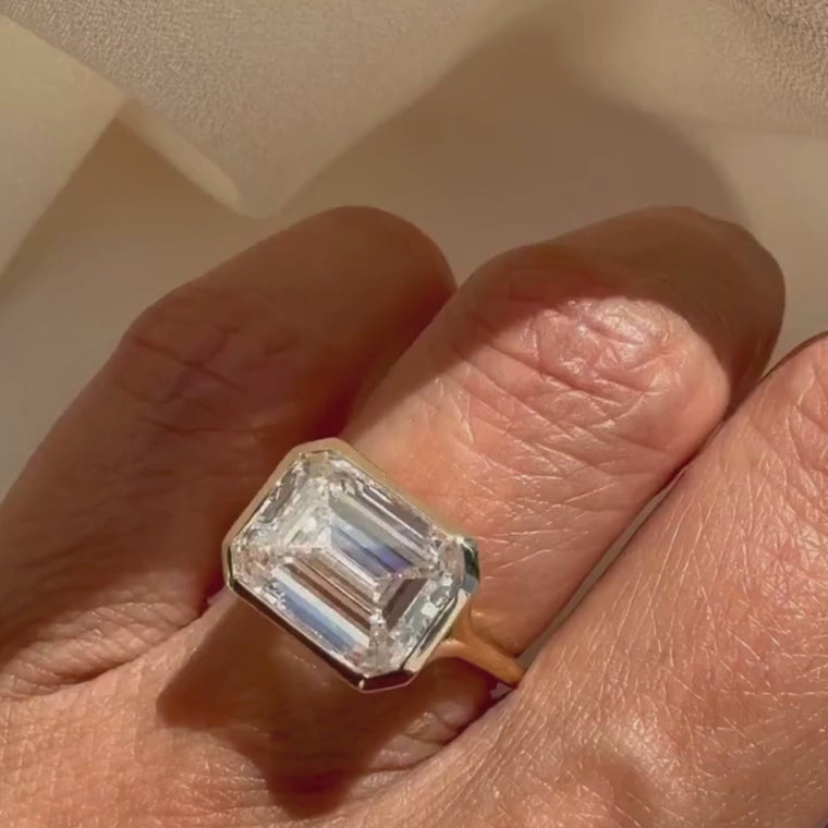 East West Emerald Cut Bezel Set Solitaire Ring video