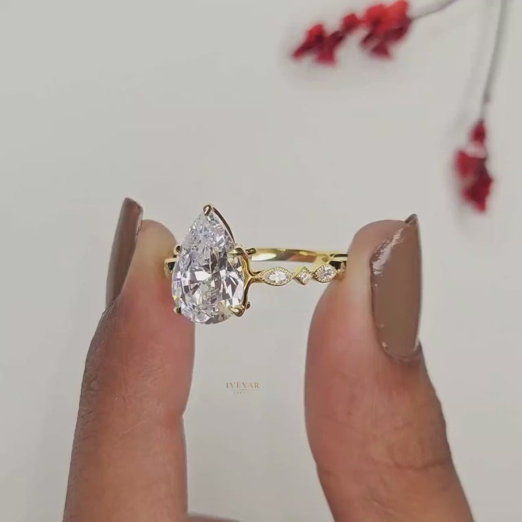 Pear Cut Ring with Marquise Side Stones video