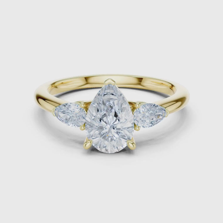 Pear Cut Three Stone Ring with Marquise Side Stones video