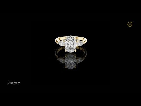 1.95 CT Classic Three Stone Lab Grown Ring with an Oval Cut Center Diamond and Pear Shaped Side Diamonds