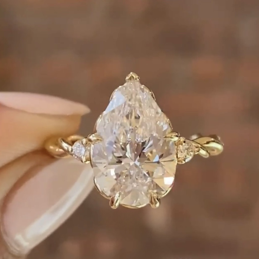 2.00 CT Celestial Pear Shaped Moissanite Diamond Engagement Ring with Twisted Accent