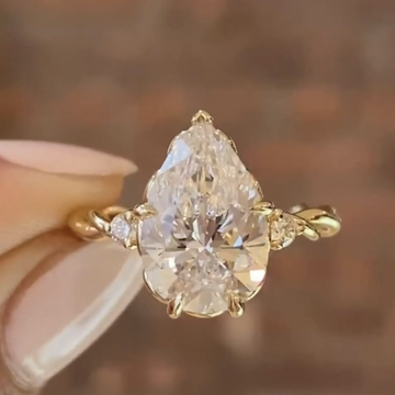 3.00 CT Celestial Pear Shaped Moissanite Diamond Engagement Ring with Twisted Accent